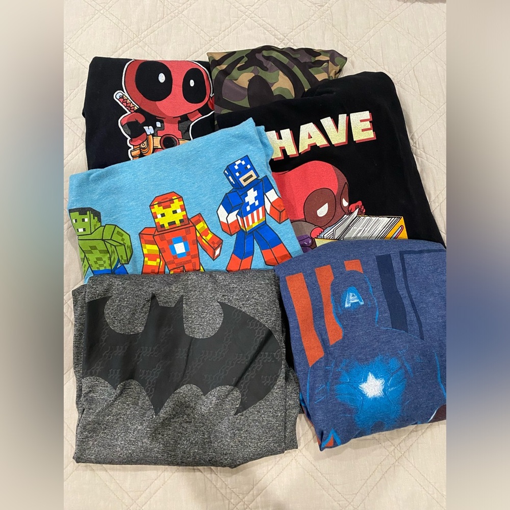 7 Men’s Medium super hero shirts